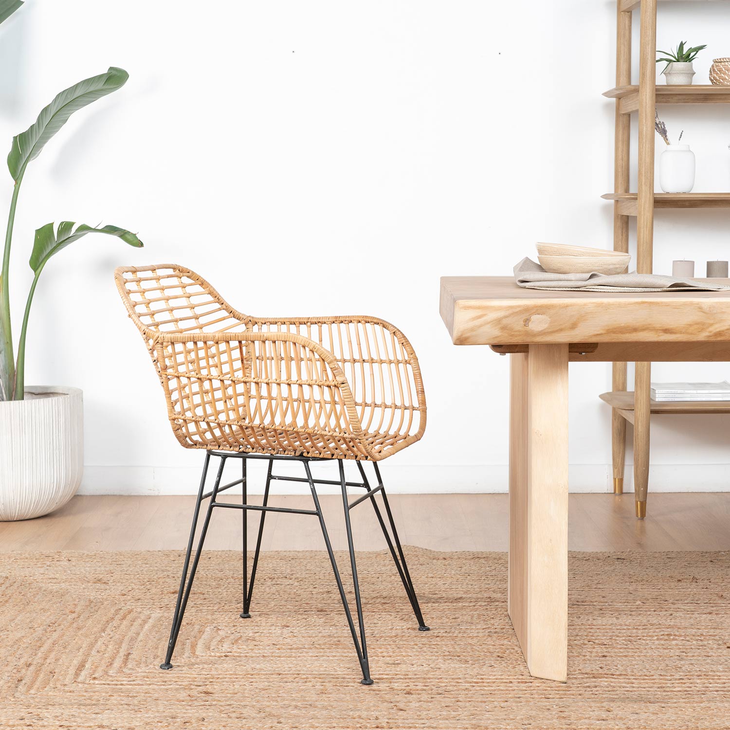 Woven chair beside a wooden desk in an Artfulwoods room setting